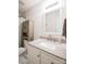 Well-lit bathroom featuring a modern sink, a framed mirror, and a shower with a decorative curtain at 222 Baldwin Ct, Rock Hill, SC 29730