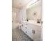 Bathroom featuring double sinks, vanity, modern tile flooring, and shower/tub combo at 222 Baldwin Ct, Rock Hill, SC 29730