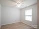 Bright, minimalist bedroom with hardwood floors and a large window at 222 Baldwin Ct, Rock Hill, SC 29730