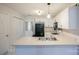 Bright kitchen featuring white cabinetry, stainless steel sink, and a black refrigerator at 222 Baldwin Ct, Rock Hill, SC 29730