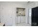 Convenient laundry room with washer, dryer, and shelving for storage at 222 Baldwin Ct, Rock Hill, SC 29730