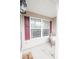 Relaxing covered porch with charming decor and ample sunlight streaming through the windows at 222 Baldwin Ct, Rock Hill, SC 29730