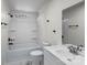 Bathroom featuring a white vanity, a toilet and a bathtub with shower at 2390 Old Wilkesboro Rd, Statesville, NC 28625