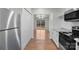 Modern kitchen with stainless steel appliances and view to the back deck at 2390 Old Wilkesboro Rd, Statesville, NC 28625