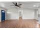 Bright living room features hardwood floors and a blue entry door at 2390 Old Wilkesboro Rd, Statesville, NC 28625