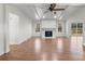 Bright living room featuring a fireplace, ceiling fan, and sliding glass doors to the back deck at 2390 Old Wilkesboro Rd, Statesville, NC 28625