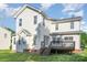 Exterior of home featuring spacious backyard and wooden deck at 2514 Waters Vista Cir, Charlotte, NC 28213