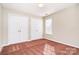 Bright bedroom with two closets and natural light from the window at 2514 Waters Vista Cir, Charlotte, NC 28213