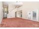 Bright living room featuring soaring ceilings, a front entry and access to the backyard patio at 2514 Waters Vista Cir, Charlotte, NC 28213