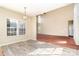 View of living room and dining area with hardwood floors leading into carpeted area at 2514 Waters Vista Cir, Charlotte, NC 28213