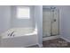 Bathroom with a soaking tub and enclosed shower at 3308 Lemongrass Ln, Charlotte, NC 28214