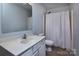 Bathroom with a single vanity, mirror, and shower at 3308 Lemongrass Ln, Charlotte, NC 28214