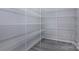 Walk-in pantry with white wire shelving and gray wood-look floors at 3308 Lemongrass Ln, Charlotte, NC 28214