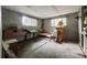 Unfinished basement with gray walls, two windows, and furniture at 3330 Foxcroft Rd, Charlotte, NC 28211