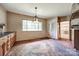 Bright dining area featuring parquet flooring, a large window with natural light, and built-in cabinets at 3330 Foxcroft Rd, Charlotte, NC 28211