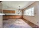Open dining area with parquet flooring, large windows offering plenty of natural light, and built-in cabinetry at 3330 Foxcroft Rd, Charlotte, NC 28211