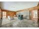 Open living room with stone fireplace and multiple entryways at 3330 Foxcroft Rd, Charlotte, NC 28211