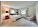Bright main bedroom with windows, natural light, and closet space at 3330 Foxcroft Rd, Charlotte, NC 28211