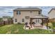 View of a spacious backyard with a covered patio and well-maintained lawn at 4026 Clover Nw Rd, Concord, NC 28027