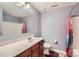 Bathroom with tiled floor, vanity sink and shower with curtain at 4026 Clover Nw Rd, Concord, NC 28027