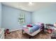 Bright bedroom with a large window and a cozy bed, perfect for relaxation at 4026 Clover Nw Rd, Concord, NC 28027