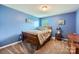 Comfortable bedroom with a bed, natural light from window, and cozy interior design at 4026 Clover Nw Rd, Concord, NC 28027