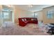 Spacious bonus room featuring plush seating and natural light from the windows at 4026 Clover Nw Rd, Concord, NC 28027