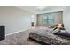 Inviting main bedroom with plush carpeting, a comfortable seating area, and ensuite bathroom access at 4026 Clover Nw Rd, Concord, NC 28027