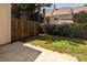 Cozy backyard features a concrete patio and a partial wooden fence around a grassy area at 4548 Antelope Ln, Charlotte, NC 28269