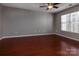 Bright bedroom with hardwood floors and a large window at 4548 Antelope Ln, Charlotte, NC 28269
