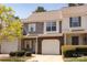 Charming townhouse featuring a brick facade, attached garage, and well-maintained landscaping at 4548 Antelope Ln, Charlotte, NC 28269