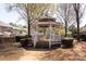 Charming gazebo surrounded by lush bushes and trees with houses visible in the background at 4548 Antelope Ln, Charlotte, NC 28269