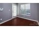 Bright room with hardwood floors, a window, and a door to the outside at 4548 Antelope Ln, Charlotte, NC 28269