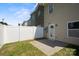 Fenced backyard with concrete patio area and green grass at 4554 Craigmoss Ln, Charlotte, NC 28278