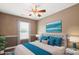 Bedroom boasts decorative trim, ceiling fan, neutral paint, and natural light at 4554 Craigmoss Ln, Charlotte, NC 28278