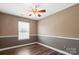 Bedroom featuring hardwood floors, natural light, ceiling fan, and neutral paint at 4554 Craigmoss Ln, Charlotte, NC 28278