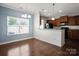 Cozy dining area with hardwood floors and natural light, adjacent to the kitchen, perfect for Gathering meals at 4554 Craigmoss Ln, Charlotte, NC 28278
