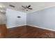 Open living room boasting hardwood floors and a neutral color scheme, offering a versatile space for various furniture arrangements at 4554 Craigmoss Ln, Charlotte, NC 28278
