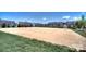 Community sand volleyball court surrounded by green space, perfect for recreational play at 4554 Craigmoss Ln, Charlotte, NC 28278
