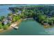 An aerial view of the waterfront property, displaying the lake and community dock at 4599 Rustling Woods Dr, Denver, NC 28037