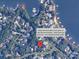 Aerial view showing a house located near a boat slip in a cove of Lake Norman at 4599 Rustling Woods Dr, Denver, NC 28037