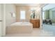 Bright bathroom featuring a soaking tub, vanity with wooden cabinets, and tiled flooring at 4599 Rustling Woods Dr, Denver, NC 28037