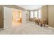 Open layout of the room to a bathroom including a soaking tub, windows, and bookshelf at 4599 Rustling Woods Dr, Denver, NC 28037
