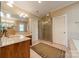 Bathroom featuring a vanity, walk-in shower with glass door, and a separate door for the toilet at 4599 Rustling Woods Dr, Denver, NC 28037