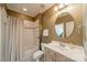 Standard bathroom with a bathtub and shower combination, neutral wall paint, and a vanity with a round mirror at 4599 Rustling Woods Dr, Denver, NC 28037