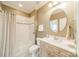 Well-lit bathroom with a vanity, shower/tub, and neutral décor at 4599 Rustling Woods Dr, Denver, NC 28037