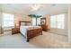 bedroom with detailed tree art, lots of light from windows, and wood furnishings at 4599 Rustling Woods Dr, Denver, NC 28037