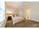 Bright bedroom with a comfortable bed and an en-suite bathroom at 4599 Rustling Woods Dr, Denver, NC 28037