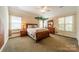 Charming bedroom with themed decor, comfortable bed, and natural light streaming through the windows at 4599 Rustling Woods Dr, Denver, NC 28037