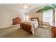 Charming bedroom features a unique mural, creating a whimsical and inviting atmosphere at 4599 Rustling Woods Dr, Denver, NC 28037